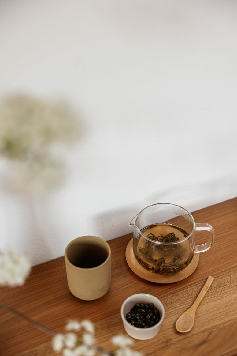 Tea in a Glass Teapot and Cups 